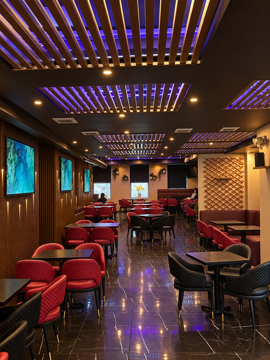 Long view of the lounge with screens